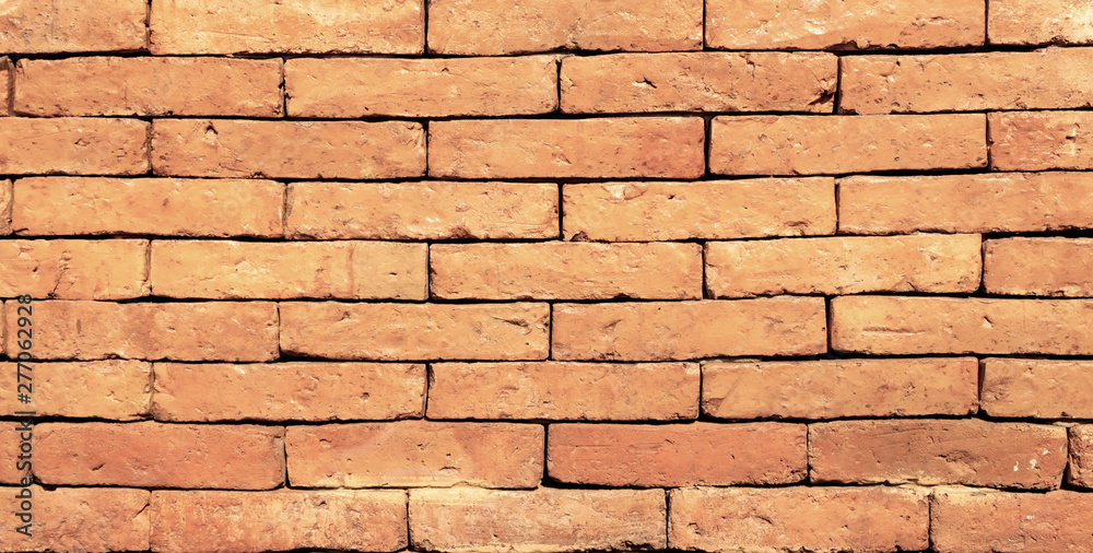 Obraz premium Antique brown brick wall of red color.texture grunge background.may use to interior design.