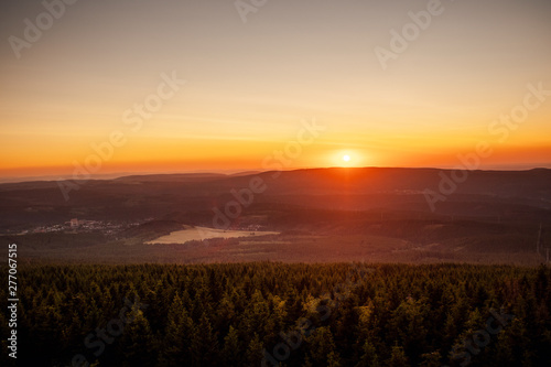 Mountain nature landscape panorama with silhouette layers and valley view at sunset colorful sky. Wolfswarte, Torfhaus, National Park Harz in Germany