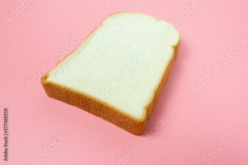 Bread on pink background, copy space for texting.