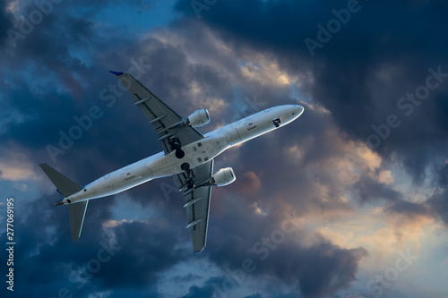 Passenger aircraft on the background of dramatic clouds.