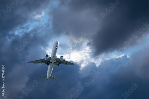 Passenger aircraft on the background of clouds.