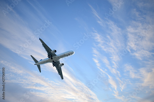 Passenger plane against the sky with clouds.