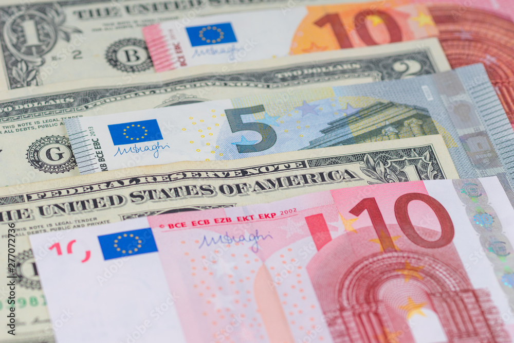 Obraz premium many different american dollars and european union euro banknotes close-up shot