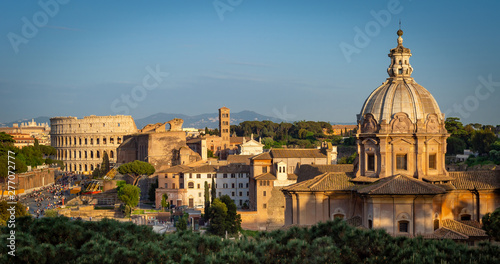  Sunset view of Colosseum and Roman Forum in Rome.