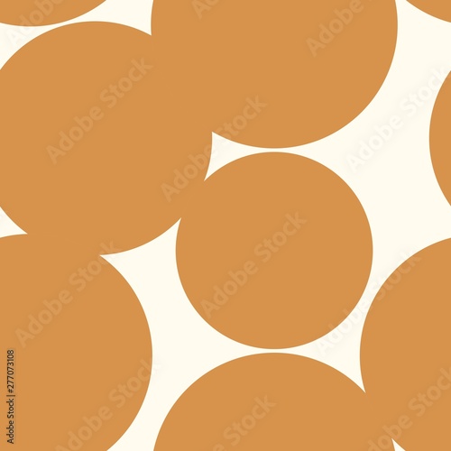 Seamless repeat pattern with big giant ocher mustard polka dots overlapping on a cream ground