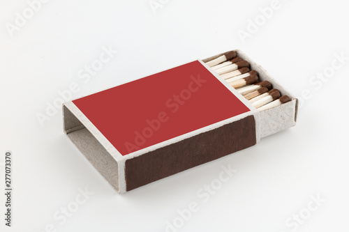 The open box of matches on white background. Side view. Blank space.