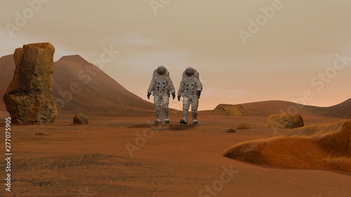 3D rendering. Colony on Mars. Two Astronauts Wearing Space Suit Walking On The Surface Of Mars.