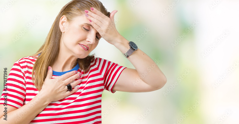 Middle age mature woman wearing casual t-shirt over isolated background Touching forehead for illness and fever, flu and cold, virus sick Middle age mature woman wearing casual t-shirt over isolated background Touching forehead for illness and fever, flu and cold, virus sick