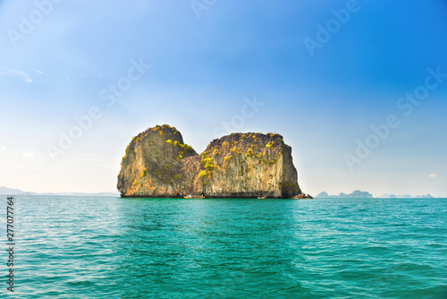 Landscape with rocky islands in tropical sea and blue sky