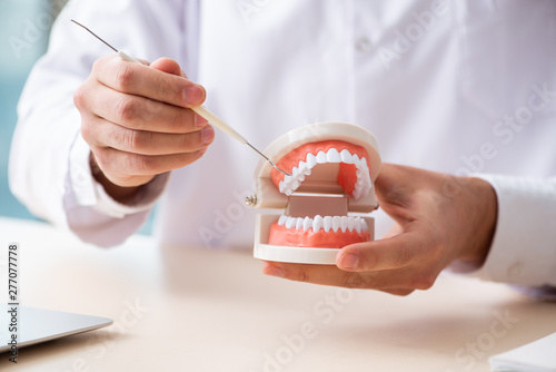 Male doctor stomatologist working in the clinic  photo