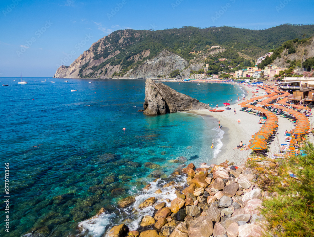 MONTEROSSO AL MARE, ITALY - JULY 28, 2016: Panoramic summer view of the beach in Monterosso, Cinque Terre, Italy.