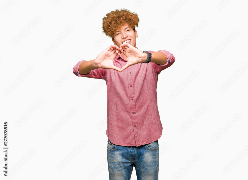 Young handsome business man with afro hair smiling in love showing heart symbol and shape with hands. Romantic concept. Young handsome business man with afro hair smiling in love showing heart symbol and shape with hands. Romantic concept.