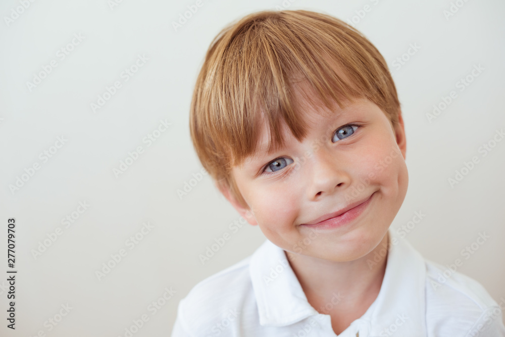 Photo of adorable young happy boy looking at camera Photo of adorable young happy boy looking at camera