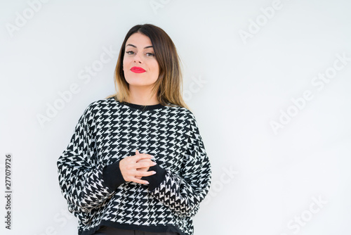 Young woman wearing casual sweater over isolated background Hands together and fingers crossed smiling relaxed and cheerful. Success and optimistic