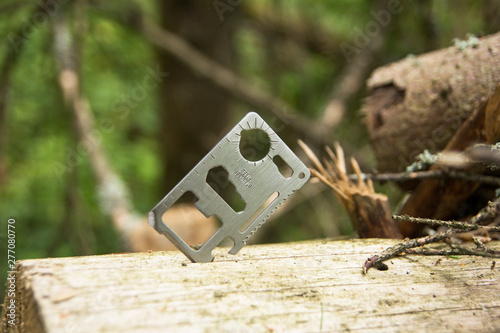 Field knife, multitool. Stuck in a tree.