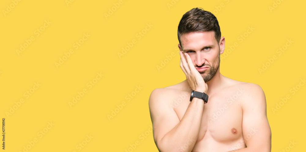 Fototapeta premium Handsome shirtless man showing nude chest thinking looking tired and bored with depression problems with crossed arms.