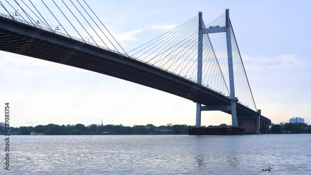 Time lapse shot of the Vidyasagar Setu over Hooghly River at dusk, Kolkata, West Bengal, India