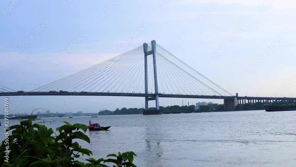 Time lapse shot of the Vidyasagar Setu over Hooghly River at dusk, Kolkata, West Bengal, India