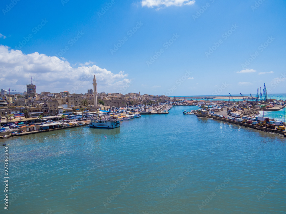 SIDON, LEBANON - MAY 21, 2017: View of the port by the Sidon Sea Castle, built by the crusaders as a fortress of the holy land.