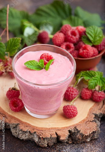 Raspberry smoothie in glass jar. Healthy refreshed homemade beverage.