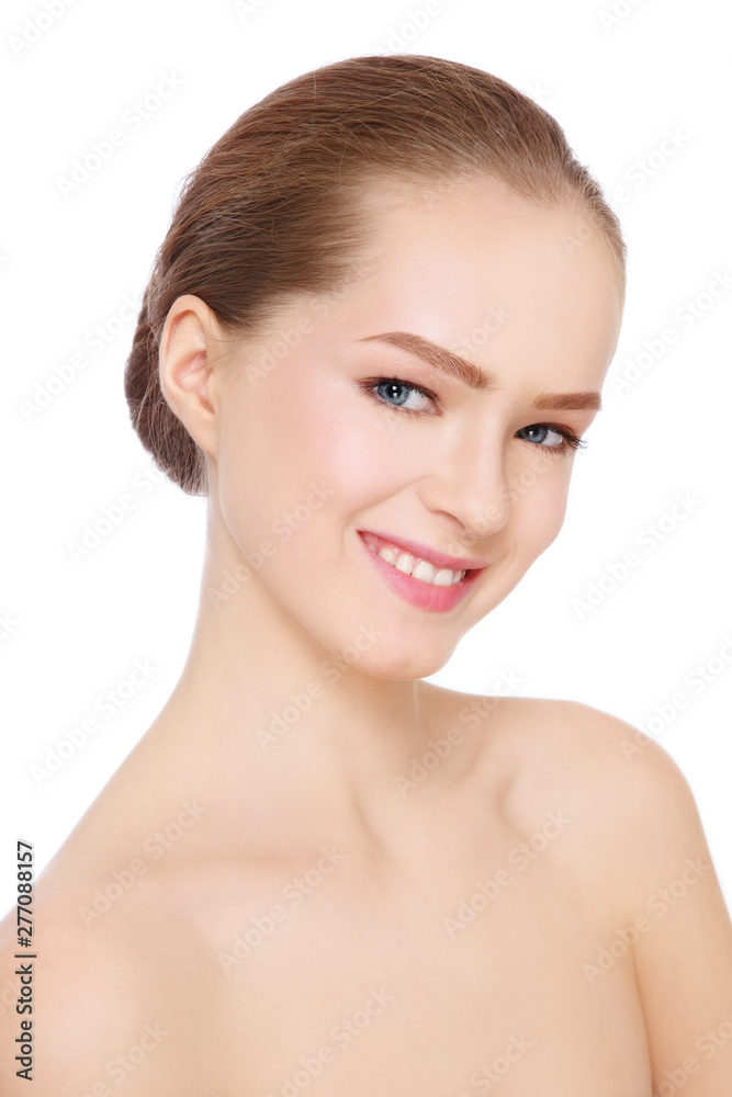 Portrait of young beautiful smiling girl with clean makeup and hair bun Portrait of young beautiful smiling girl with clean makeup and hair bun