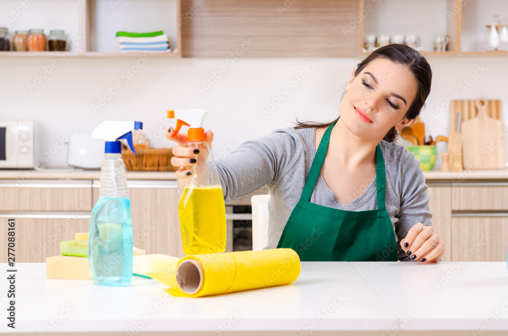 Young female contractor doing housework Young female contractor doing housework