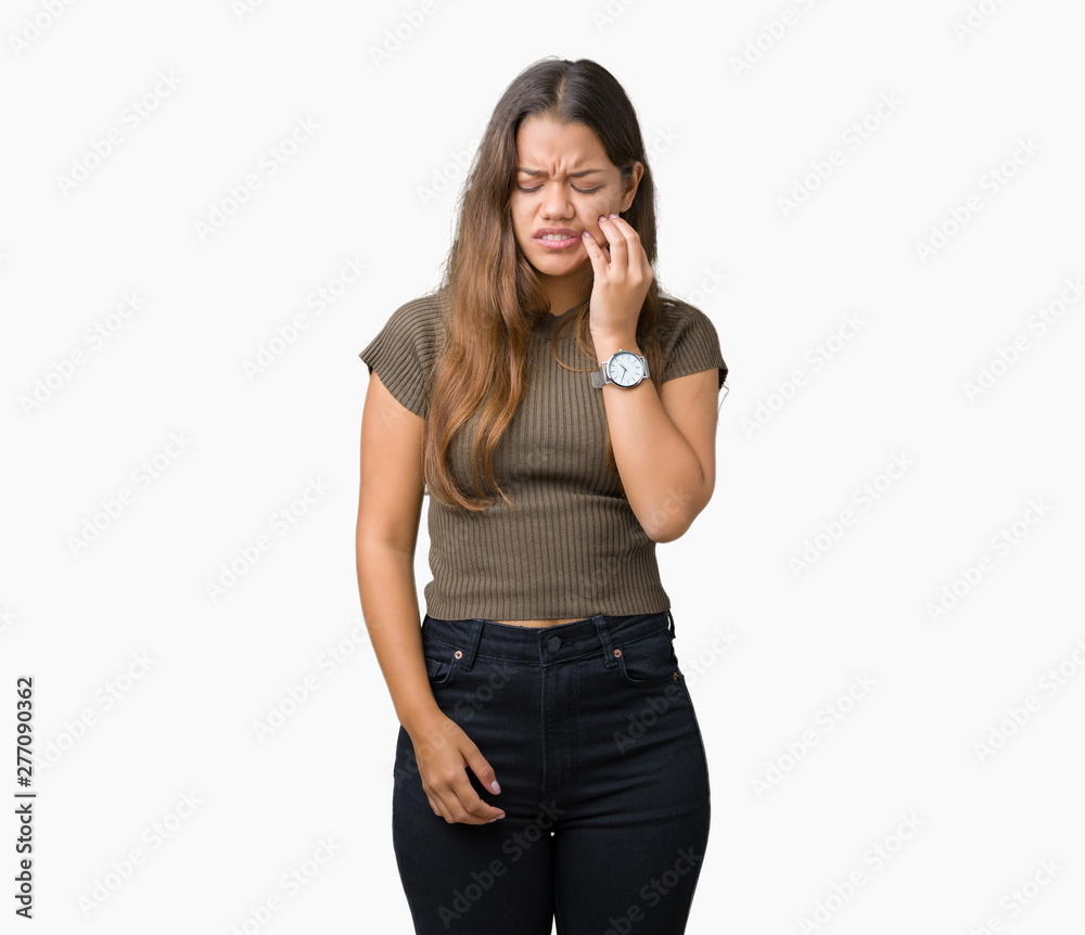 Young beautiful brunette woman over isolated background touching mouth with hand with painful expression because of toothache or dental illness on teeth. Dentist concept. Young beautiful brunette woman over isolated background touching mouth with hand with painful expression because of toothache or dental illness on teeth. Dentist concept.