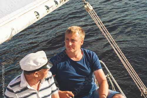 two yachtsmen aboard a yacht