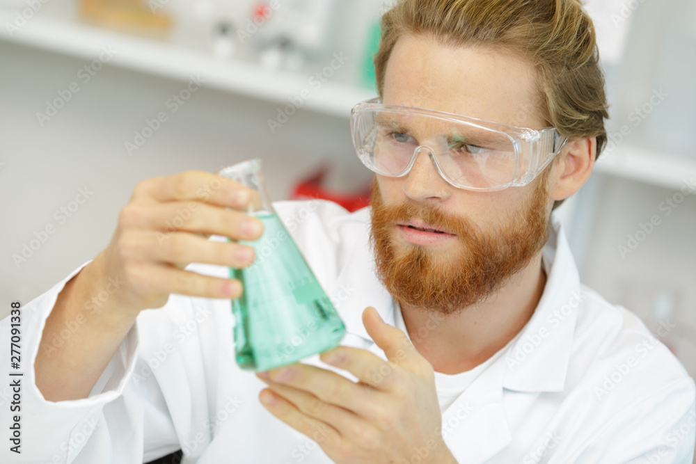man lab assistant conducts experiments man lab assistant conducts experiments