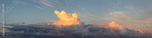 Dramatic Panoramic View of a cloudscape during a dark, rainy and colorful morning sunrise. Taken over Beach Ancon in Trinidad, Cuba.