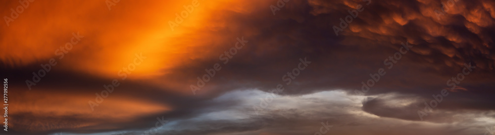 Fototapeta premium Dramatic Panoramic View of a cloudscape during a dark and colorful sunset. Taken over Beach Ancon in Trinidad, Cuba.