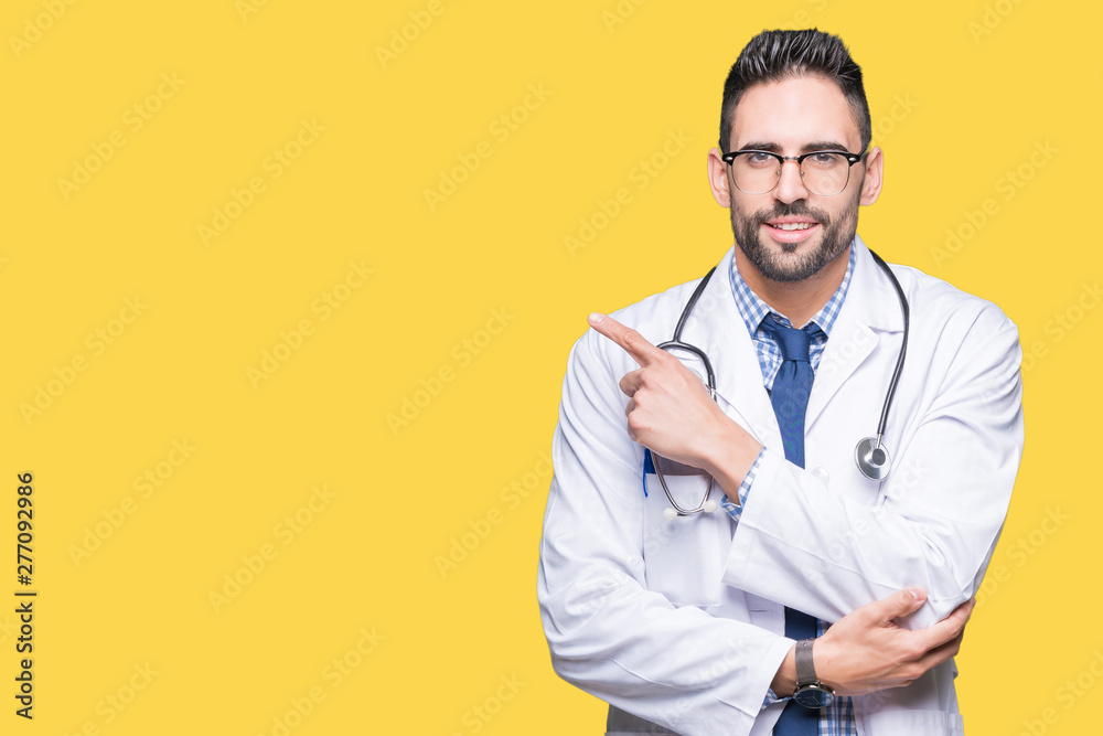 Handsome young doctor man over isolated background Pointing with hand finger to the side showing advertisement, serious and calm face Handsome young doctor man over isolated background Pointing with hand finger to the side showing advertisement, serious and calm face