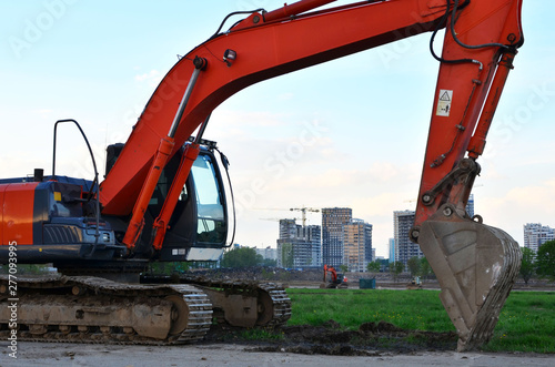 Crawler excavator in construction site on blue sky background. Special heavy construction equipment - Image photo