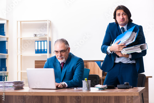 Young and old employees working together in the office 