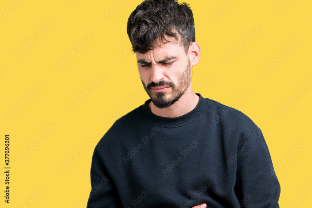 Young handsome man over isolated background with hand on stomach because nausea, painful disease feeling unwell. Ache concept. Young handsome man over isolated background with hand on stomach because nausea, painful disease feeling unwell. Ache concept.