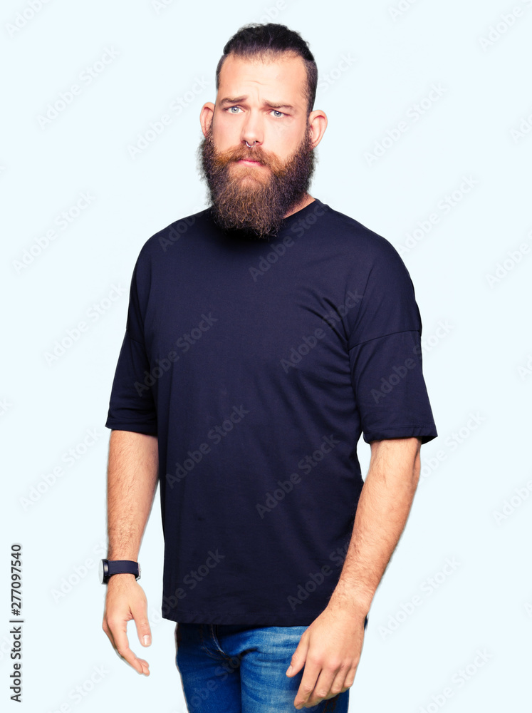Young blond man wearing casual t-shirt depressed and worry for distress, crying angry and afraid. Sad expression. Young blond man wearing casual t-shirt depressed and worry for distress, crying angry and afraid. Sad expression.