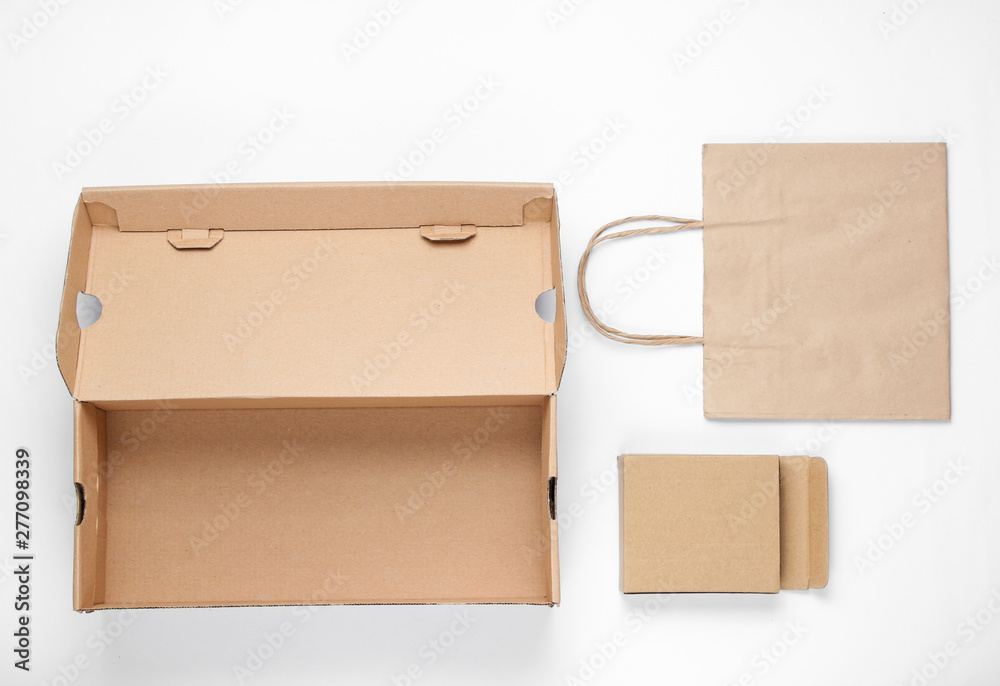 Eco concept. Cardboard boxes, paper bag on a white background. Top view