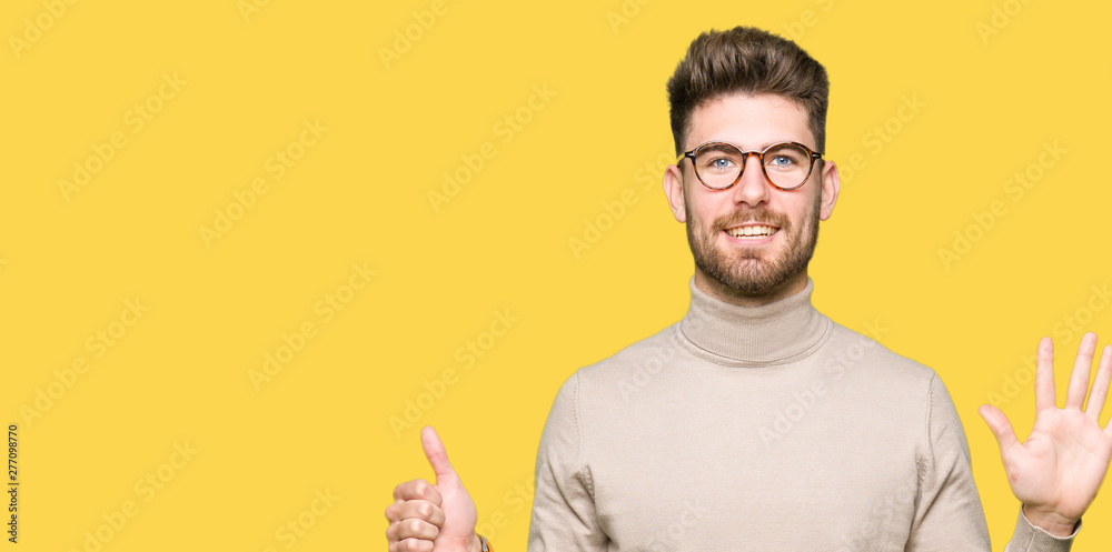 Young handsome business man wearing glasses showing and pointing up with fingers number six while smiling confident and happy. Young handsome business man wearing glasses showing and pointing up with fingers number six while smiling confident and happy.