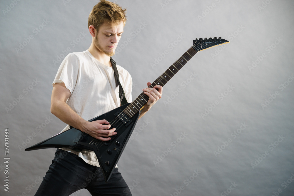 Fototapeta premium Man playing on electric guitar