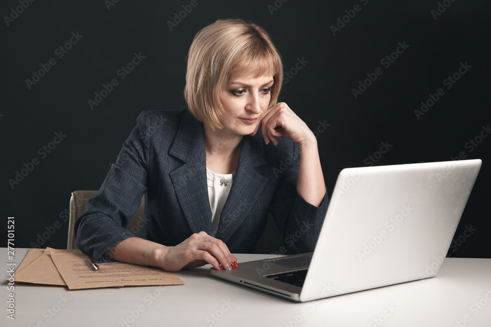 Woman attorney sitting at a workplace and working laptop. Female lawyer concept Woman attorney sitting at a workplace and working laptop. Female lawyer concept