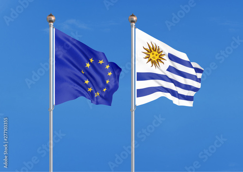 European Union vs Uruguay. Thick colored silky flags of European Union and Uruguay. 3D illustration on sky background. - Illustration