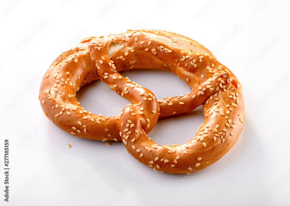 traditional pretzel  with sesame seeds close-up on white background