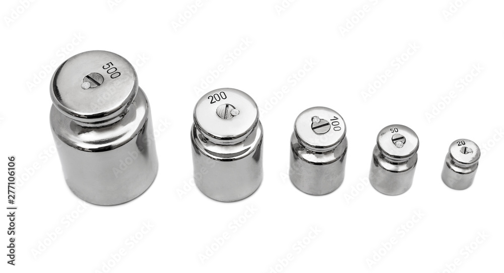 Row of weights for laboratory scales on white. Row of weights for laboratory scales on white.