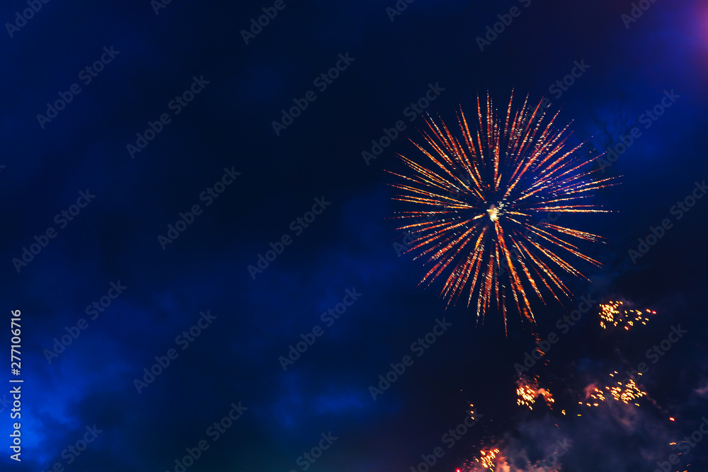Inexpensive fireworks over the city sky, red, blue and white. Bright and shiny. Selective focus. For any purpose. Celebration concept. Inexpensive fireworks over the city sky, red, blue and white. Bright and shiny. Selective focus. For any purpose. Celebration concept.