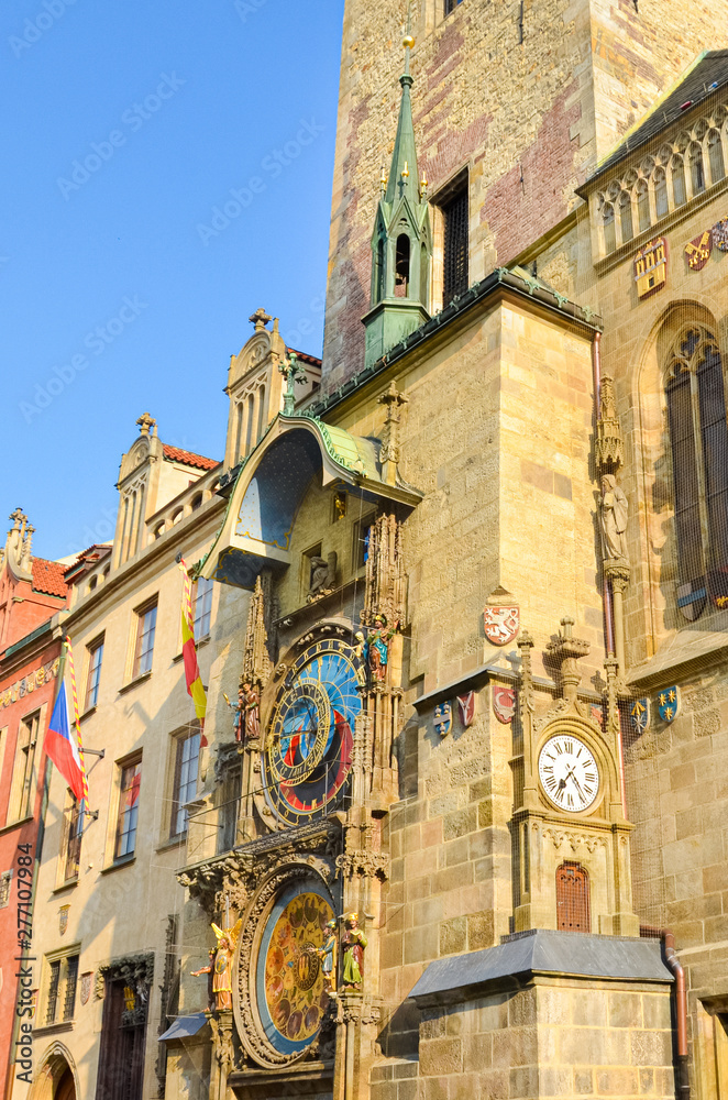 Beautiful Prague astronomical clock, Orloj, located on the Old Town Square in historical center of Prague, Czech Republic. Part of Old Town Hall. Golden hour. Tourist attraction. Famous site. Czechia