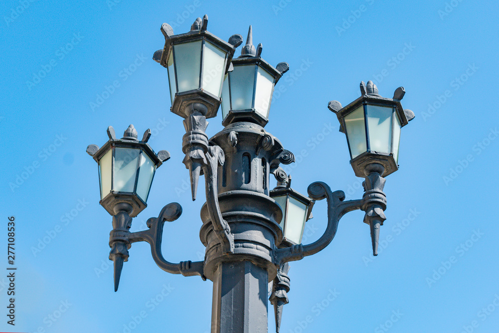 Lamppost on background of blue sky