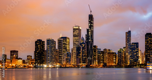 Panoramic view of Chicago city high rise buildings cloudy sky in the evening © Rawf8
