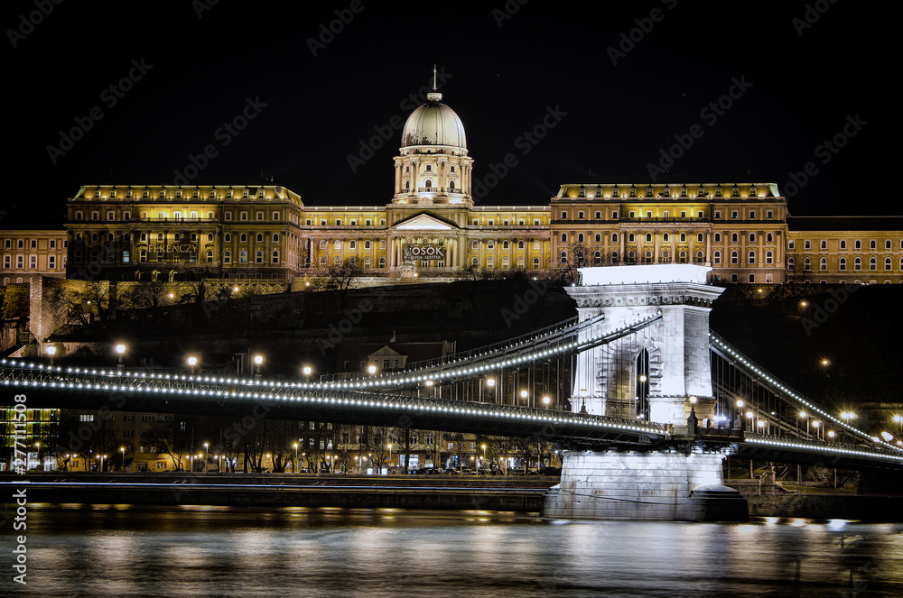Night view of the Szechenyi Chain Bridge in Budapest, Hungary, is a suspension bridge that spans the River Danube between Buda and Pest