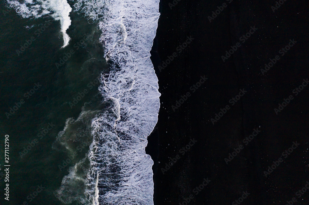 Overhead view of scenic sea waves on black sand beach in Iceland - obrazy, fototapety, plakaty 