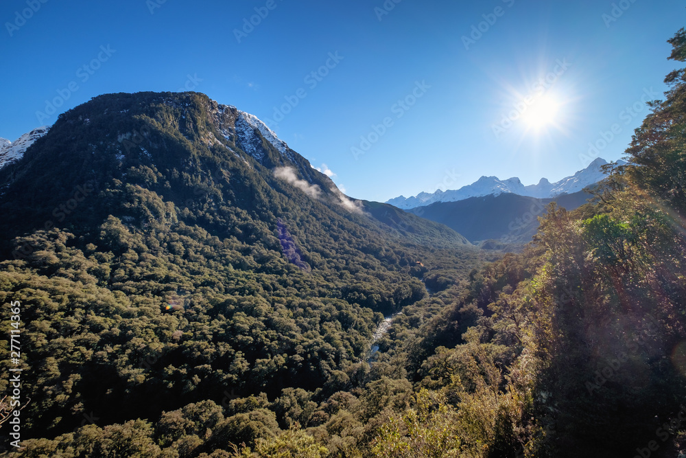 Fototapeta premium Nature landscape image of sunshine and mountain valley in Te Anau, New Zealand. Motivational scenery image with copy space of south island, New Zealand.